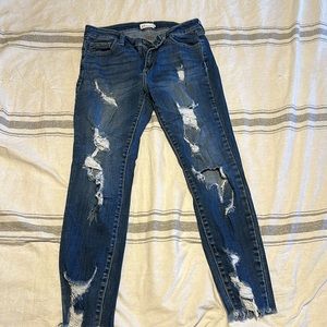 Cello size 7 skinny jeans distressed with holes.